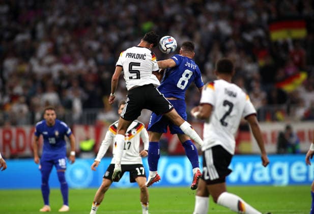Germany vs. Serbia, Soccer, Men s, 2026–2027 Season, International Match, Nations League, Matchday 3, League A, Group 2, Allianz Arena: Aleksandar Pavlovic (Germany, left) and Luka Jovic (Serbia, right) in an aerial duel, heading the ball, battling for possession