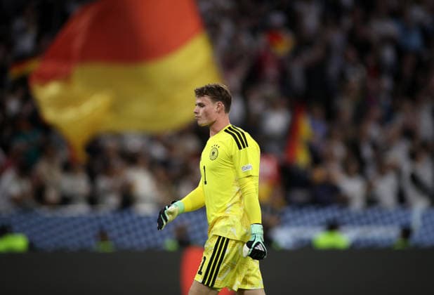 Germany vs. Serbia, Soccer, Men s, 2026–2027 Season, International Match, Nations League, Matchday 3, League A, Group 2, Allianz Arena: Jonas Urbig (Germany) – head and upper body, seen in profile from the side, with the German flag in the background