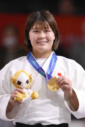 Aichi-Nagoya Asian Games: Judo Japan s Mizuki Sugimura poses after winning the Aichi-Nagoya Asian Games women s judo 78-kilogram gold at Aichi International Arena in Nagoya, central Japan, on Oct. 2, 2026.  A14AA0005629775P