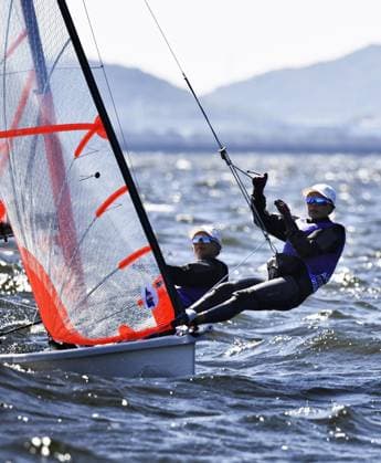 Aichi-Nagoya Asian Games: Sailing Japanese sailors Natsumi Funazawa (L) and Natsuko Funazawa compete en route to winning the Aichi-Nagoya Asian Games girls skiff silver off Kaiyoh Yacht Harbor in Gamagori in Aichi Prefecture, central Japan, on Oct. 2, 2026. A14AA0005629824P