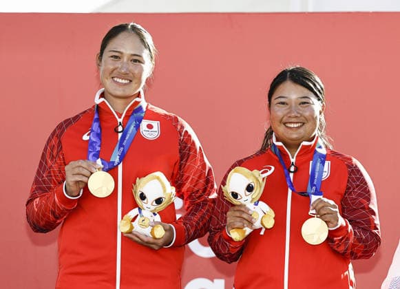 Aichi-Nagoya Asian Games: Sailing Japanese sailors Misaki Tanaka (R) and Sera Nagamatsu pose during the medal ceremony held at Kaiyoh Yacht Harbor in Gamagori in Aichi Prefecture, central Japan, on Oct. 2, 2026, a day after winning gold in the Aichi-Nagoya Asian Games women s skiff. A14AA0005629829P