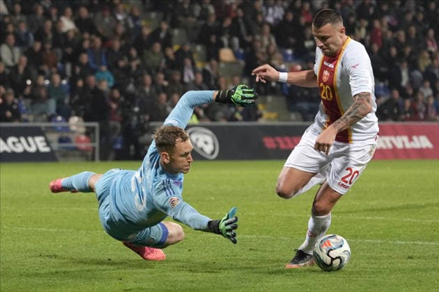 Goalkeeper Rihards Matrevics (23) of Latvia In action against Milutin Osmajic (20) of Montenegro during UEFA Nations League Group C2 football game between Latvia and Montenegro in Riga, Latvia, Fri, Oct. 2, 2026. Riga Latvia Copyright: xRomanxKoksarovx RKV09935.JPG