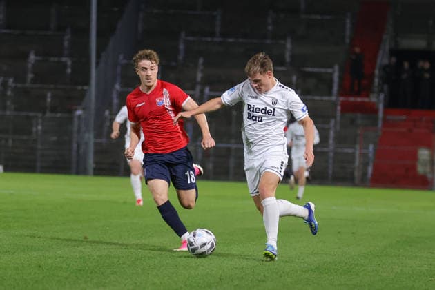 October 2, 2026, Soccer, Men s, Bavarian Regional League, 2026–2027 Season, Matchday 12: SpVgg Unterhaching vs. FC Schweinfurt 05. From left: Dominik Lindermeir (SpVgg Unterhaching, No. 18) and Gil Ebner (FC Schweinfurt 05, No. 08). Unterhaching, Uhlsport Park, Unterhaching, Bavaria, Germany