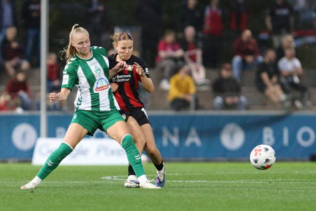 Isabella Jaron of SV Werder Bremen and Estrella Merino Gonzalez of Bayer 04 Leverkusen battle for the ball during the Women s Bundesliga match between Bayer 04 Leverkusen and SV Werder Bremen at Ulrich Haberland Stadium on October 2, 2026, in Leverkusen, Germany. Photo by Oliver Kaelke, DeFodi Images. Isabella Jaron of SV Werder Bremen and Estrella Merino Gonzalez of Bayer 04 Leverkusen battle for the ball during the Bundesliga match between Bayer 04 Leverkusen and SV Werder Bremen at Ulrich Haberland Stadium on October 2, 2026 in Leverkusen, Germany. Photo by Oliver Kaelke, DeFodi Images. DFB and DFL regulations prohibit any use of photographs as image sequences and or quasi-video. Photo by Oliver Kaelke, DeFodi Images.