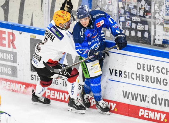 Nicholas Halloran of the Straubing Tigers at the boards with Akito Hirose of the Bremerhaven Pinguins, Men s Ice Hockey, German Ice Hockey League, Penny DEL, Matchday 5, 2026–2027 season on October 2, 2026, at the Eisstadion am Pulverturm, Straubing Tigers (blue) vs. Pinguins Bremerhaven (white)