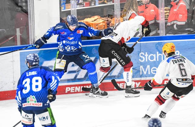 Adrian Klein of the Straubing Tigers at the boards with Ludwig Bystroem of the Bremerhaven Pinguins, Men s Ice Hockey, German Ice Hockey League, Penny DEL, Matchday 5, 2026–2027 season on October 2, 2026, at the Eisstadion am Pulverturm, Straubing Tigers (blue) vs. Pinguins Bremerhaven (white)