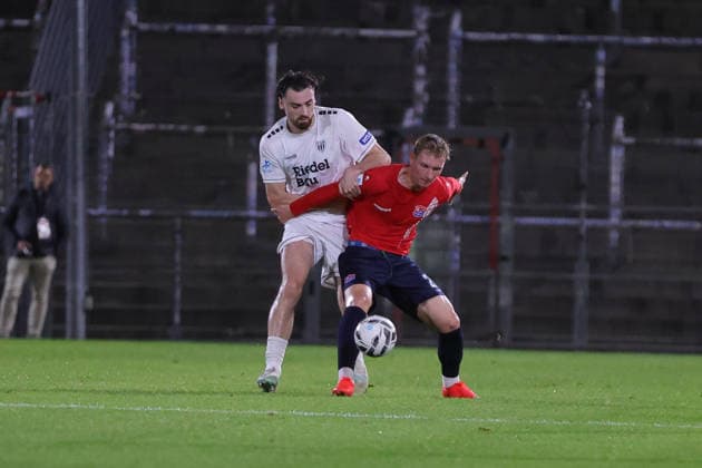October 2, 2026, Soccer, Men s, Bavarian Regional League, 2026–2027 Season, Matchday 12: SpVgg Unterhaching vs. FC Schweinfurt 05. From left: Pietro Besso (FC Schweinfurt 05, No. 23) and Cornelius Pfeiffer (SpVgg Unterhaching, No. 22). Unterhaching Uhlsport Park, Unterhaching, Bavaria, Germany