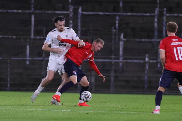 October 2, 2026, Soccer, Men s, Bavarian Regional League, 2026–2027 Season, Matchday 12: SpVgg Unterhaching vs. FC Schweinfurt 05. From left: Pietro Besso (FC Schweinfurt 05, No. 23) and Cornelius Pfeiffer (SpVgg Unterhaching, No. 22). Unterhaching Uhlsport Park, Unterhaching, Bavaria, Germany