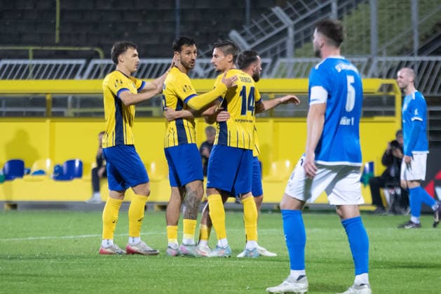 Soccer: Saxony Cup, 1. FC Lok Leipzig vs. SV Liebertwolkwitz, October 2, 2026. From left: Jonas Arcalean (17), Lok Leipzig, and Filip Kusic (36), Lok Leipzig, celebrate with Alexander Siebeck (14), Lok Leipzig, after his goal gave them a 1–0 lead. Soccer, 2026–2027 Wernesgrüner Saxony Cup, Round 3: 1 FC Lok Leipzig vs. SV Liebertwolkwitz on October 2, 2026, at Bruno Plache Stadium, Leipzig Copyright: xBEAUTIFULxSPORTS JanxKaeferx