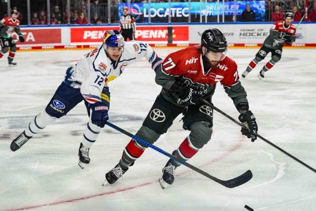 Ice Hockey: DEL Matchday 5—Cologne Sharks vs. EHC Red Bull Munich on October 2, 2026, at the Lanxess Arena in Cologne. Brady Ferguson (Munich), on the left, Ryan Macinnis (Cologne); on the right. In accordance with the regulations of the DEL (German Ice Hockey League), the publication and further use of the footage in electronic media and on devices of any kind during the game is not permitted. xDMx