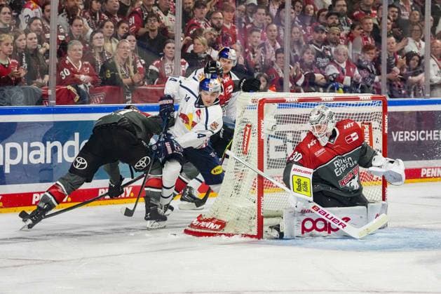 Ice Hockey: Penny DEL, Matchday 5—Cologne Sharks vs. EHC Red Bull Munich on October 2, 2026, at the Lanxess Arena in Cologne. Veli Matti Vittasmäki (Cologne), left: Luis Becker (Munich), center: Janne Juvonen (Cologne), right: In accordance with the regulations of the DEL (German Ice Hockey League), the publication and further use of the images in electronic media and on devices of any kind during the game is not permitted. xDMx