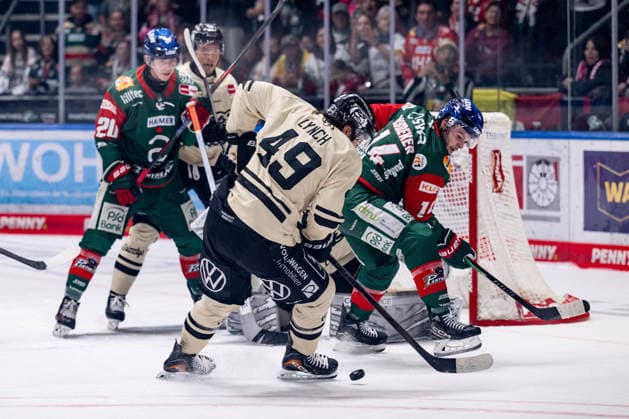 Bobby Lynch of the Grizzlys Wolfsburg, No. 49, defends against Donald D. J. Busdeker of the Augsburger Panther, No. 14 (GER), Augsburger Panther vs. Grizzlys Wolfsburg, ice hockey, DEL, 2026–2027 season, Matchday 4, October 2, 2026 Photo: HMB Media, Heike Feiner Copyright: HMBxMedia HeikexFeiner