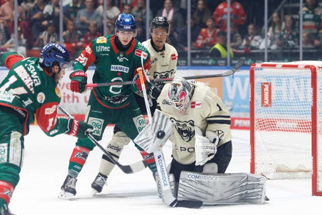 Dustin Strahlmeier 1, Grizzlys Wolfsburg; Philipp Krauss 20, Augsburger Panther; and Madison Bowey 22, Grizzlys Wolfsburg, during the game between the Augsburger Panther and the Grizzlys Wolfsburg, ice hockey, men s, DEL, 2026–2027, Matchday 5 on October 2, 2026, in Augsburg, Curt Frenzel Stadium, Bavaria, Germany