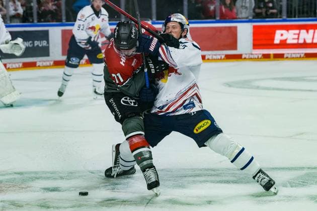 Ice Hockey: Penny DEL, Matchday 5—Cologne Sharks vs. EHC Red Bull Munich on October 2, 2026, at the Lanxess Arena in Cologne. Daniel Fischbuch, Cologne, left: Patrick Hager (Munich), right: In accordance with the regulations of the DEL (German Ice Hockey League), the publication and further use of the images in electronic media and on devices of any kind during the game is not permitted xDMx