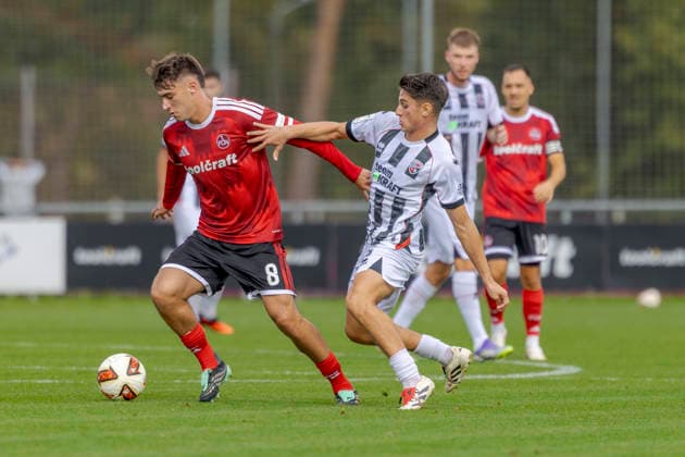 Nuremberg, Germany, October 2, 2026; Friendly Match 2026–2027: 1. FC Nürnberg vs. FC Ingolstadt 04. Pictured, from left, in a tackle: Javier Fernandez (FCN) and Emre Gül Guel (FCI). Sportpark Valznerweiher, Bavaria. Copyright: xFotostandx xSchäferx