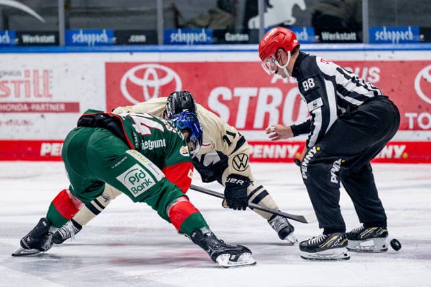 Linesman Maksim Cepik officiates a faceoff between Trevor Parkes of the Augsburger Panther (84) and Justin Feser of the Grizzlys Wolfsburg (71, GER), Augsburger Panther vs. Grizzlys Wolfsburg, ice hockey, DEL, 2026–2027 season, Matchday 4, October 2, 2026. Photo: HMB Media, Heike Feiner Copyright: HMBxMedia HeikexFeiner