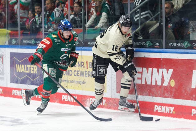 Tommy Pasanen, 16, of the Grizzlys Wolfsburg, and Philipp Krauss, 20, of the Augsburger Panther, during the game between the Augsburger Panther and the Grizzlys Wolfsburg, ice hockey, men s, DEL, 2026–2027, Matchday 5 on October 2, 2026, in Augsburg, Curt Frenzel Stadium, Bavaria, Germany