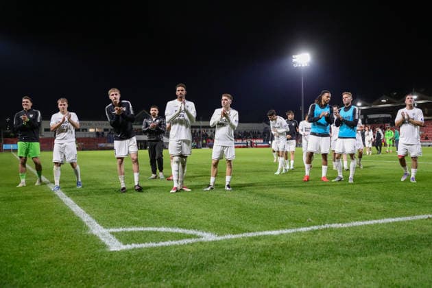 October 2, 2026, Soccer, Men s, Bavarian Regional League, 2026–2027 Season, Matchday 12: SpVgg Unterhaching vs. FC Schweinfurt 05. After the final whistle, the Schweinfurt players thank the fans who traveled with them in the visitors’ section at Unterhaching Uhlsport Park, Unterhaching, Bavaria, Germany