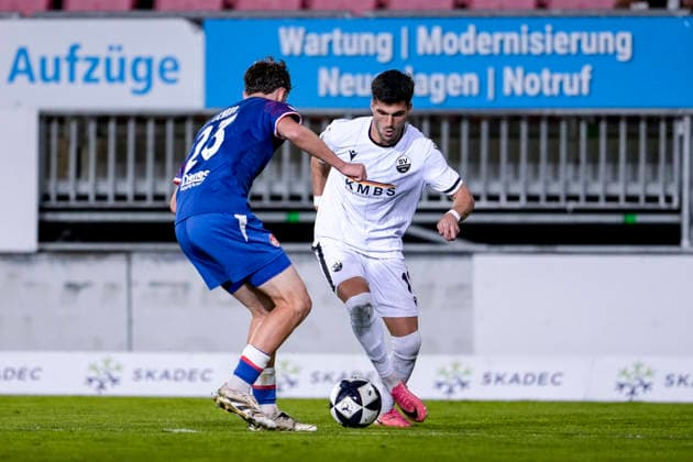 v li Kian Scheer FCK, 23, Mert Tasdelen SVS, 11, tackle, game scene, duel, tackle, tackling, dynamics, action, 02 10 2026, Sandhausen, Germany, soccer, Regionalliga Southwest, SV Sandhausen 1 vs. FC Kaiserslautern II xozx