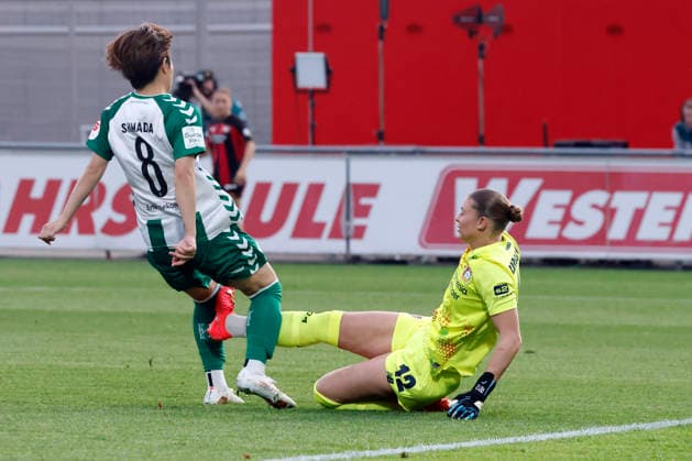 Soccer player Mei Shimada (SV Werder Bremen, No. 8), a forward, is tackled by goalkeeper Rafaela Borggräfe (Bayer 04 Leverkusen, No. 12), Goal scored during the match between the Bayer 04 Leverkusen Women’s First Team and SV Werder Bremen, final score 3–2, on Matchday 6 of the Google Pixel Women’s Bundesliga at Ulrich Haberland Stadium in Leverkusen, October 2, 2026. DFB regulations prohibit any use of photographs as image sequences and or quasi-video. NRW, Germany Copyright: xChristophxHardtx
