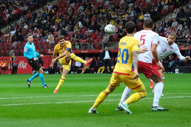 October 2, 2026, Warsaw, Masovian Voivodeship, Poland: Romania s IANIS HAGI (14) and DENNIS MAN (20) in action against Poland s JAN BEDNAREK (5) and MATTY CASH (2) during a UEFA Nations League Group B4 match between the Polish and Romanian national teams at the PGE Narodowy Stadium in Warsaw. Poland went on to win against Romania 6 goals to 0. Soccer 2026: UEFA Nations League: Poland 6:0 Romania  - ZUMAk204 20261002_zip_k204_010 Copyright: xRomanxKozielx