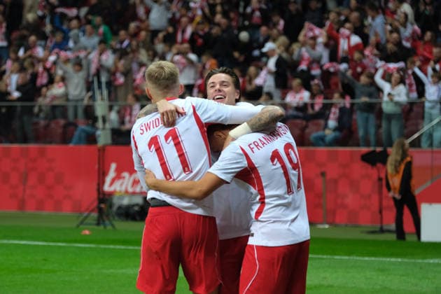 October 2, 2026, Warsaw, Masovian Voivodeship, Poland: Poland s NICOLA ZALEWSKI (21), KAROL SWIDERSKI (11), and PRZEMYSLAW FRANKOWSKI (19) celebrate after a Romania own-goal during a UEFA Nations League Group B4 match between the Polish and Romanian national teams at the PGE Narodowy Stadium in Warsaw. Poland went on to win against Romania 6 goals to 0. Soccer 2026: UEFA Nations League: Poland 6:0 Romania - ZUMAk204 20261002_zip_k204_025 Copyright: xRomanxKozielx