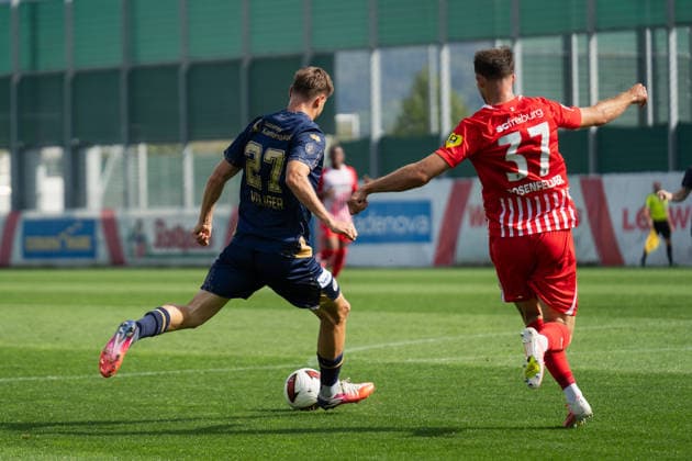 October 3, 2026, xjyhynx, soccer exhibition match, SC Freiburg vs. FC Lucerne, from left: Lars Villiger (27), FC Lucerne takes a shot on goal, defended by Max Rosenfelder (37), SC Freiburg, Freiburg