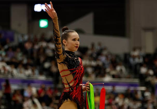 (261003) -- NAGOYA, Oct. 3, 2026 -- Takhmina Ikromova of Uzbekistan greets the spectators during the Individual All-Around Final of Rhythmic gymnastics, Rhythmische Sportgymnastik, RSG at 20th Asian Games Aichi-Nagoya 2026 in Nagoya, Japan, Oct. 3, 2026. ) (SP)JAPAN-NAGOYA-ASIAN GAMES-RHYTHMIC GYMNASTICS-INDIVIDUAL ALL-AROUND-FINAL WuxZhizun