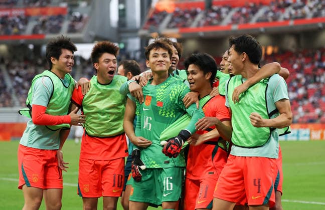(261003) -- TOYOTA, Oct. 3, 2026 -- Players of China celebrate after winning the men s 3rd place match of football between China and Uzbekistan at 20th Asian Games Aichi-Nagoya 2026 in Toyota of Aichi Prefecture, Japan, Oct. 3, 2026. ) (SP)JAPAN-TOYOTA-ASIAN GAMES-FOOTBALL-MEN S 3RD PLACE MATCH-CHN VS UZB JiaxHaocheng