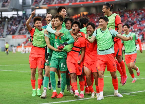 (261003) -- TOYOTA, Oct. 3, 2026 -- Players of China celebrate after winning the men s 3rd place match of football between China and Uzbekistan at 20th Asian Games Aichi-Nagoya 2026 in Toyota of Aichi Prefecture, Japan, Oct. 3, 2026. ) (SP)JAPAN-TOYOTA-ASIAN GAMES-FOOTBALL-MEN S 3RD PLACE MATCH-CHN VS UZB JiaxHaocheng