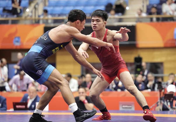 (261003) -- NAGOYA, Oct. 3, 2026 -- Zou Wanhao (R) of China competes against Bekzat Almaz Uulu of Kyrgyzstan during the men s freestyle 57kg bronze medal match of Wrestling at the 20th Asian Games Aichi-Nagoya 2026 in Nagoya, Japan, Oct. 3, 2026. ) (SP)JAPAN-NAGOYA-ASIAN GAMES-WRESTLING-MEN S FREESTYLE 57KG-BRONZE MEDAL MATCHES LongxLei