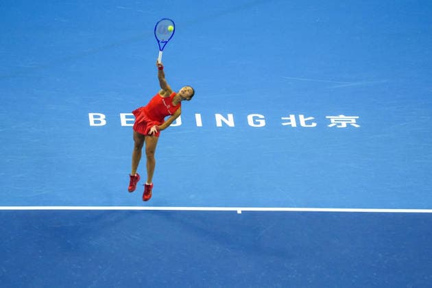 (261003) -- BEIJING, Oct. 3, 2026 -- Zheng Qinwen of China serves to Anna Kalinskaya of Russia during the women s singles second round match at 2026 China Open tennis tournament in Beijing, China, Oct. 3, 2026. ) (SP)CHINA-BEIJING-TENNIS-CHINA OPEN-WOMEN S SINGLES(CN) XiexHan 