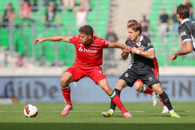 October 3, 2026, xtgx, soccer exhibition match, Hannover 96 vs. SC Verl, from left: Benedikt Pichler (Hannover), 11, Mika Clausen (Verl) – tackle, duel, battle, DFL DFB REGULATIONS PROHIBIT ANY USE OF PHOTOGRAPHS AS IMAGE SEQUENCES AND OR QUASI-VIDEO Hannover