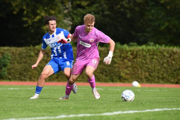 Soccer, 2026–27 Season, U19 Bundesliga Preliminary Round, Group A, FC St. Pauli vs. FC Hansa Rostock, Hammer Park Stadium, Hamburg, October 3, 2026, Matchday 9: Anton Kolmeier (12), FCSP, goalkeeper; Damian Kolano (8), FCH, team captain; Hamburg, Germany