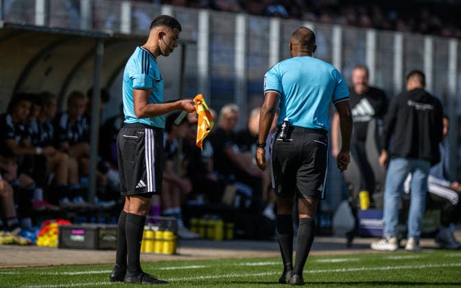 Soccer, 2026–2027 Season, Regionalliga West, October 3, 2026, Matchday 11, Men s, 1 FC Bocholt (black) vs. FC Guertsloh (white); Emircan Kandemir, Assistant Referee; Jonah Besong, Referee; Bocholt Stadion am Huenting, North Rhine-Westphalia, Germany 261003_fb_1fc-bocholt_fc-guetersloh_59433