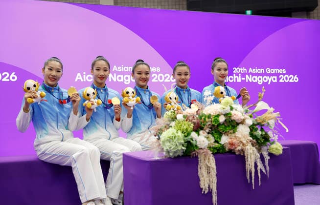 (261003) -- NAGOYA, Oct. 3, 2026 -- Gold medalist team China poses after the awarding ceremony for the Group All-Around of Rhythmic gymnastics, Rhythmische Sportgymnastik, RSG at 20th Asian Games Aichi-Nagoya 2026 in Nagoya, Japan, Oct. 3, 2026. ) (SP)JAPAN-NAGOYA-ASIAN GAMES-RHYTHMIC GYMNASTICS-GROUP ALL-AROUND-FINAL WuxZhizun 
