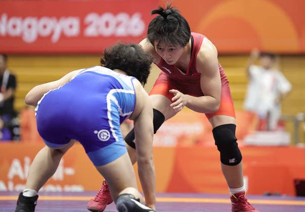 (261003) -- NAGOYA, Oct. 3, 2026 -- Hong Kexin (R) of China competes against Son Il Sim of the Democratic People s Republic of Korea (DPRK) during the women s wrestling 57kg final at the 20th Asian Games Aichi-Nagoya 2026 in Nagoya, Japan, Oct. 3, 2026. ) (SP)JAPAN-NAGOYA-ASIAN GAMES-WRESTLING-WOMEN S 57KG-FINAL LongxLei 