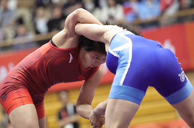 (261003) -- NAGOYA, Oct. 3, 2026 -- Hong Kexin (L) of China competes against Son Il Sim of the Democratic People s Republic of Korea (DPRK) during the women s wrestling 57kg final at the 20th Asian Games Aichi-Nagoya 2026 in Nagoya, Japan, Oct. 3, 2026. ) (SP)JAPAN-NAGOYA-ASIAN GAMES-WRESTLING-WOMEN S 57KG-FINAL LongxLei