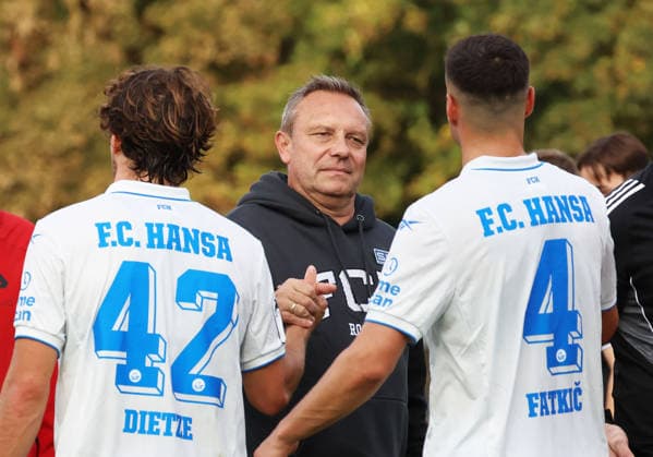 SV Gützkow vs. FC Hansa Rostock, Gützkow, October 3, 2026, Soccer, MV State Cup SV Gützkow FC Hansa Rostock Coach André Breitenreiter of FC Hansa Rostock is satisfied after the 0–11 win here with Benno Dietze of FC Hansa Rostock and Kenan Fatkic of FC Hansa Rostock Gützkow Friedrich Ludwig Jahn Stadium Mecklenburg-Western Pomerania Germany