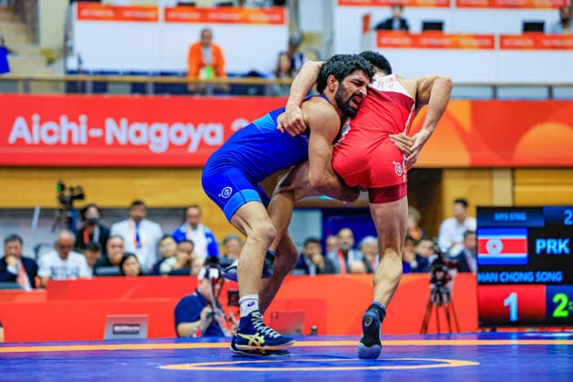 Asian Games, 57 kg Freestyle: Aman Aman (IND) def. Chongsong Han (PRK) Copyright: xAmirrezaxAliasgarix