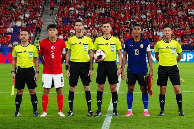 HONG KONG-SPORTS ASEAN-CUP The captains of Hong Kong, China and Cambodia pose for photographs with match officials after exchanging pennants and taking part in the pre-match coin toss ahead of the FIFA ASEAN Challenge Cup final at Kai Tak Stadium in Hong Kong on October 3, 2026. (Photo by Zulu Lo TMHK via Nexpher Images) Hong Kong