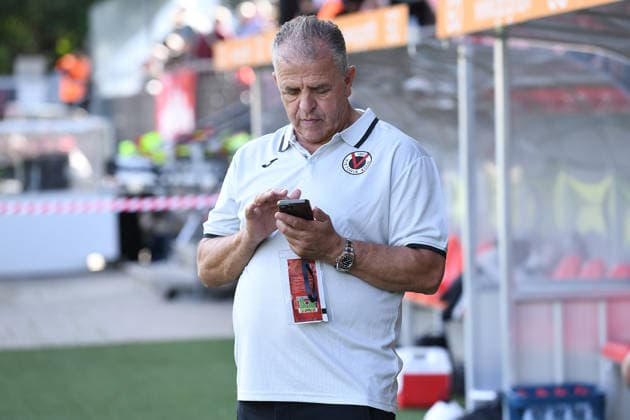 Soccer friendly match: FC Viktoria Köln vs. 1. FC Köln on October 3, 2026, at Sportpark Höhenberg in Cologne; Franz Wunderlich, Vice President of Köln, with his cell phone xRx