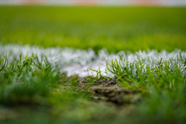 Soccer: UEFA Nations League 2026–2027, Matchday 3: Switzerland vs. Slovenia at Swissporarena Lucerne. Close-up of a soccer field with white field markings, viewed from a low angle. Individual blades of grass, marking paint, and a damaged area of the turf with exposed soil. Soccer, soccer field, playing field, turf, natural turf, grass, field markings, line, white line, turf, turf damage, ground, close-up, detailed shot, low-angle shot, sports facility, field maintenance Copyright: xJOERANxSTEINSIEKx