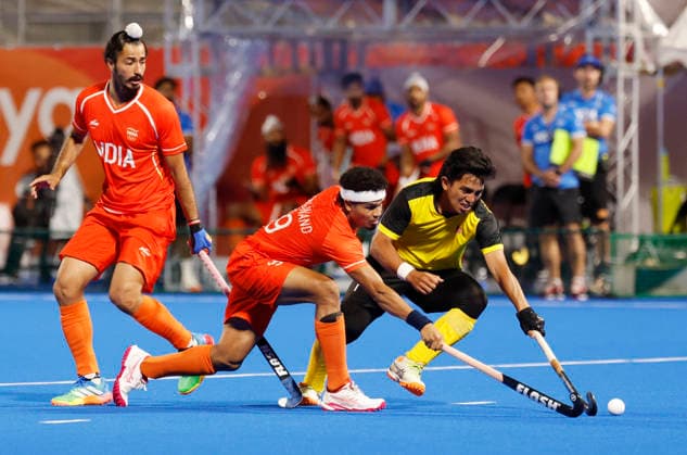 Asian Games - Aichi-Nagoya 2026 Kakamigahara Japan , Oct 03 (ANI): Asian Games - Aichi-Nagoya 2026 - Field hockey, Feldhockey - Men - Gold Medal Match - India v Malaysia - Gifu Prefectural Green Stadium, Kakamigahara, Japan - October 3, 2026 India s Shilanand Lakra in action with Malaysia s Fitri Saari REUTERS Manami Yamada ANI Photo KAKAMIGAHARA Japan Copyright: xManamixYamadax ANI_20261003279