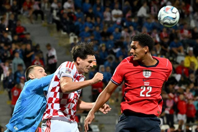 RIJEKA, CROATIA - OCTOBER 03: Dominik Livakovic of Croatia (L) in action against Jarell Quansah of England (R) during the UEFA Nations League, League A Group A3, match between Croatia and England at Stadion Rujevica, Rijeka on October 03, 2026 in Rijeka, Croatia. (Photo by Igor Kupljenik Sports Press Photo). Copyright: xIgorxKupljenikx xSPPx Sportspressphoto_SPR244625
