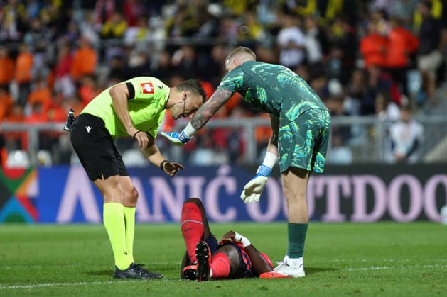 Rijeka, Croatia, 3rd October 2026. UEFA Nations League. Matchday 3, Group A3. Croatia v England at Rujevica, Rijeka. Referee and Jordan PICKFORD (1) standing above injured English player. Croatia v England, UEFA Nations League.