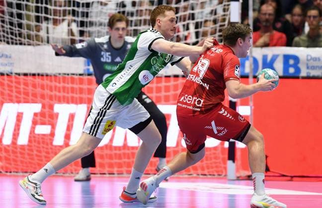 Reynir Thor Stefansson, MT Melsungen 19, on the ball; Lukas Stutzke, TSV Hannover Burgdorf 39; Joel Birlehm, goalkeeper, TSV Hannover Burgdorf 35, in the back; GER, MT Melsungen vs. TSV Hannover Burgdorf, Handball, 1st Bundesliga, Matchday 7, 2026–2027 Season, October 3, 2026, GER, MT Melsungen vs. Hannover Burgdorf, Handball, 1st Bundesliga, Matchday 7, 2026–2027 season, October 3, 2026, Kassel Copyright: xEibner-Pressefotox xRolandxSippelx EP_RSL