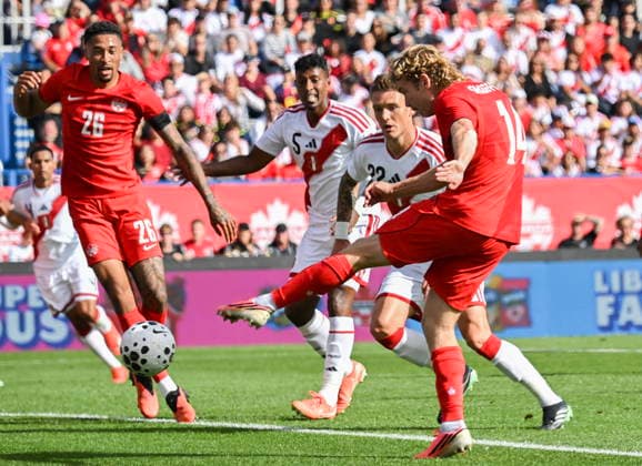 October 3, 2026, Montreal, Pq, Canada: Canada s Jacob Shaffelburg (14) scores against Peru during first half International Friendly, Länderspiel, Nationalmannschaft soccer action in Montreal, on Saturday, Oct. 3, 2026. Canada News - October 3, 2026 - ZUMAc35_ 20261003_zaf_c35_028 Copyright: xGrahamxHughesx