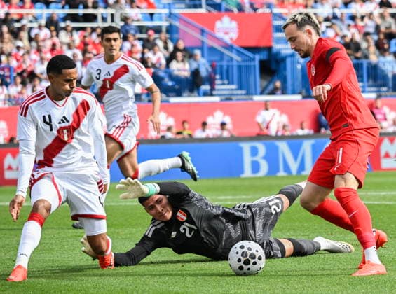 October 3, 2026, Montreal, Pq, Canada: Peru goalkeeper Diego Romero (21) and Marcos Lopez (4) defend against Canada s Liam Millar (11) during first half International Friendly, Länderspiel, Nationalmannschaft soccer action in Montreal, on Saturday, Oct. 3, 2026. Canada News - October 3, 2026 - ZUMAc35_ 20261003_zaf_c35_031 Copyright: xGrahamxHughesx