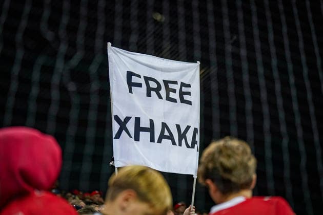 Soccer UEFA Nations League 2026–2027, Matchday 3: Switzerland vs. Slovenia at Thermoplan Arena Lucerne; Swiss fans in the stands holding a white banner reading FREE XHAKA ; spectators, fans, Switzerland, Swiss national team, Nati, Granit Xhaka, Xhaka, Free Xhaka, banner, slogan banner, fan poster, message, fan culture, support, solidarity, stands, fan section, soccer, UEFA Nations League Copyright: xJOERANxSTEINSIEKx